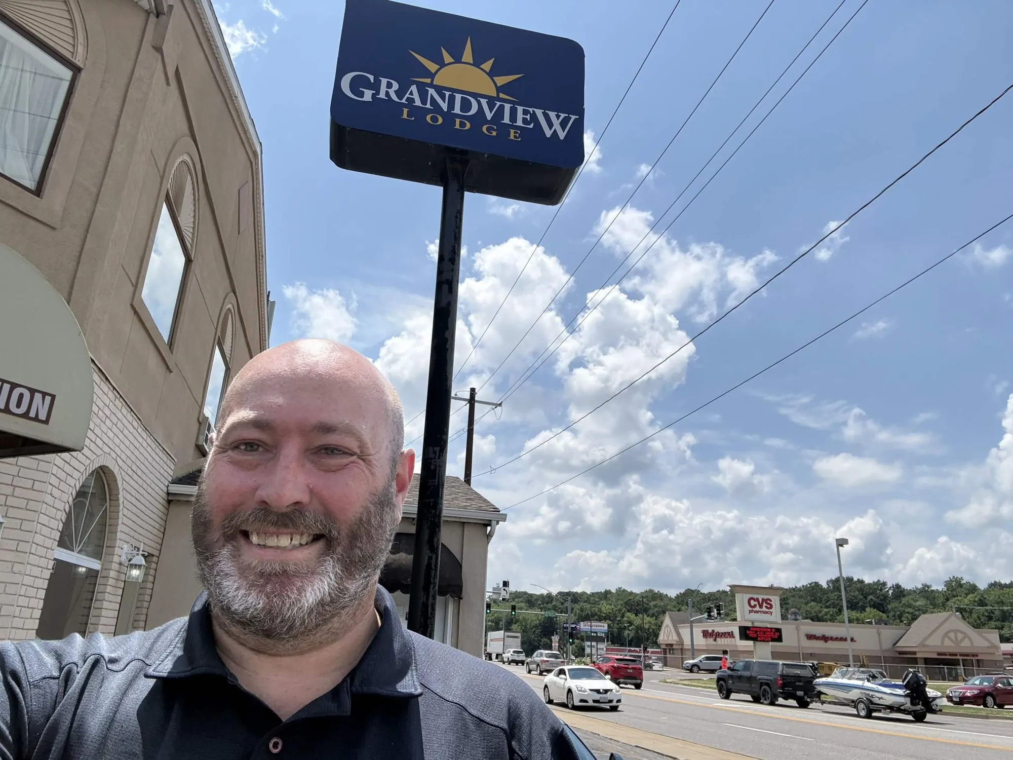 Andrew, the on-site manager, under the Grandview Lodge sign